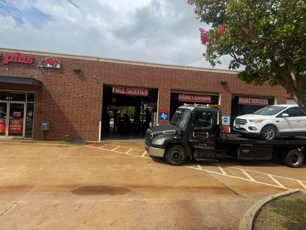 West Dallas Towing - 24/7 Roadside Assistance Dallas TX West Dallas Towing roadside assistance technician delivering vehicle to brake shop in Dallas
